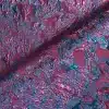 Tissu texturé violet et turquoise chatoyant