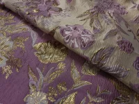 Tissu floral violet et doré brodé.